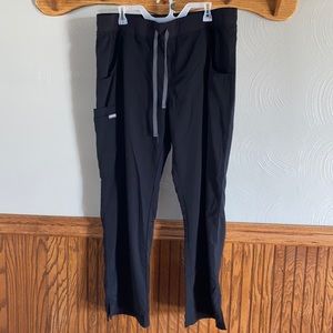 Black scrub pants with wide elastic waist band and tie closure